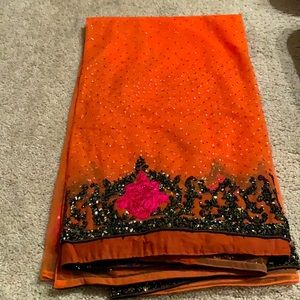 Orange and pink combination full of bling saree.